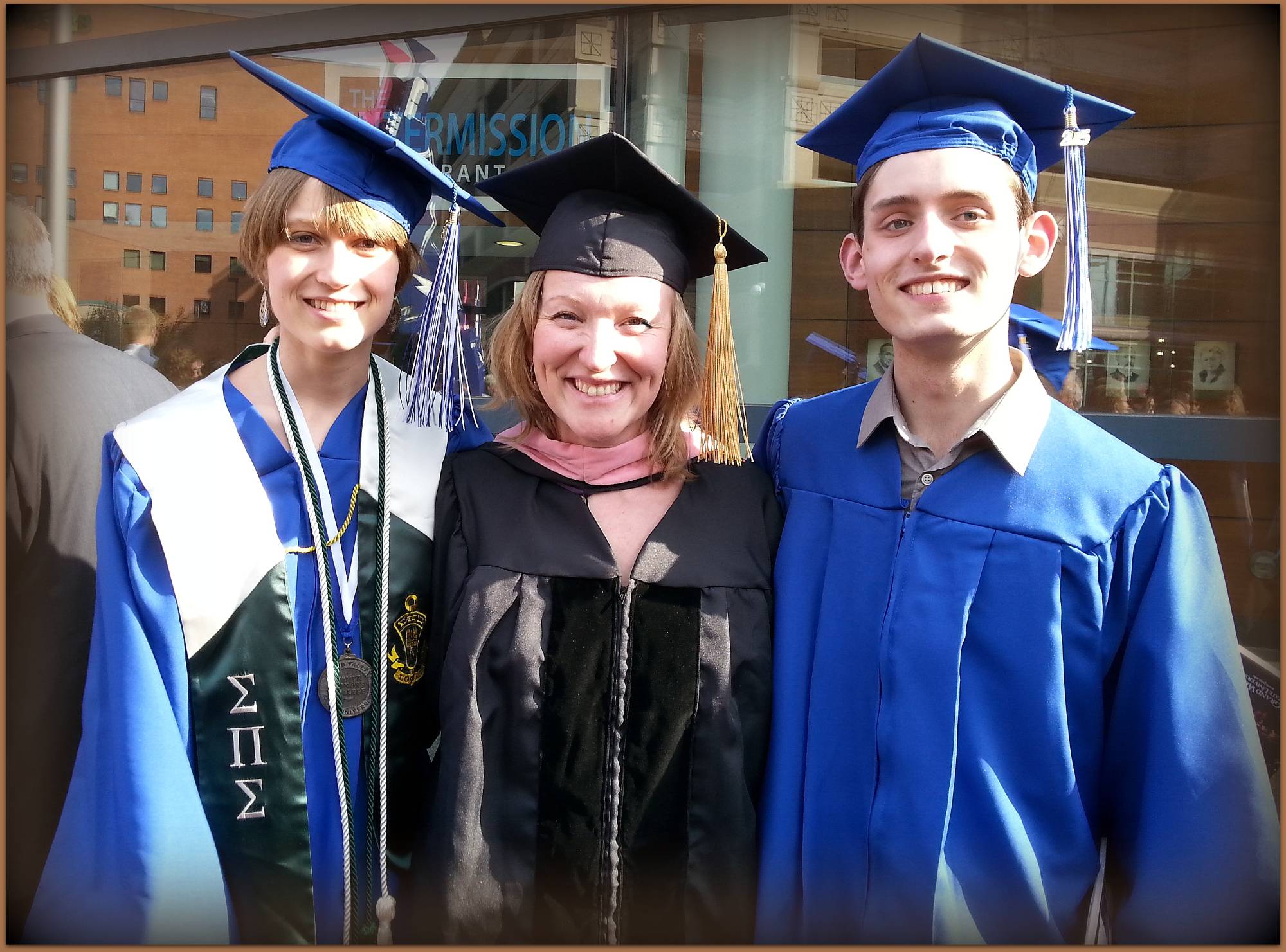 Julia Gjebic and Richie Arndorfer standing in front of Van Andel Arena with Dr. Vavrikova